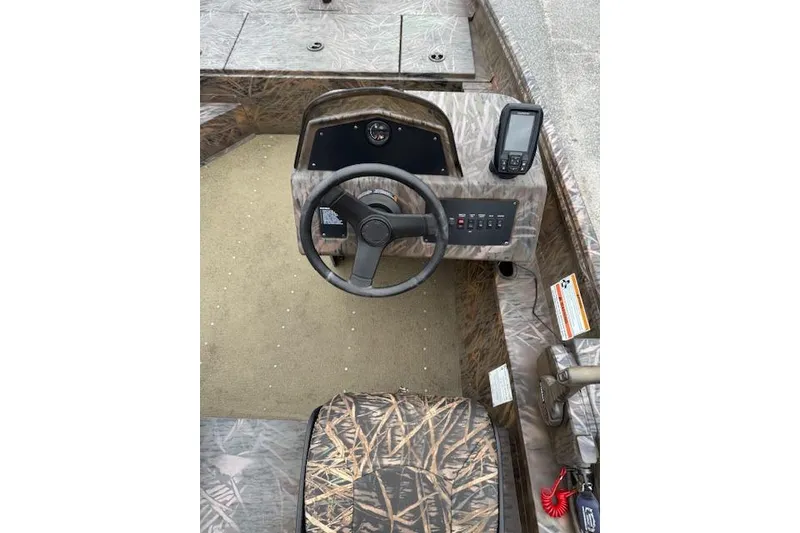 Slide: The Image of 2023 G3 Gator Tough 17 SC boat interior with steering wheel and control panel. - 9