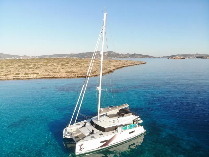 The Image of 2023 Fountaine Pajot Tanna 47 catamaran docked at a marina, featuring solar panels. - 0