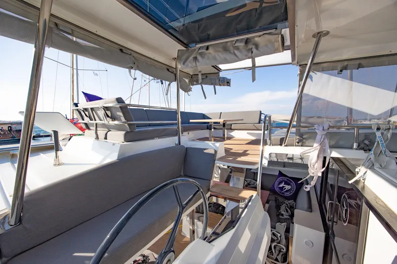 Slide: The Image of Spacious interior of 2023 Fountaine Pajot Tanna 47 catamaran with modern seating and table. - 13