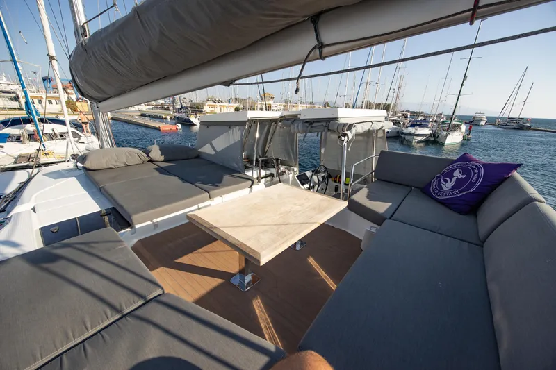 Slide: The Image of 2023 Fountaine Pajot Tanna 47 yacht cockpit with steering wheel and navigation equipment. - 15