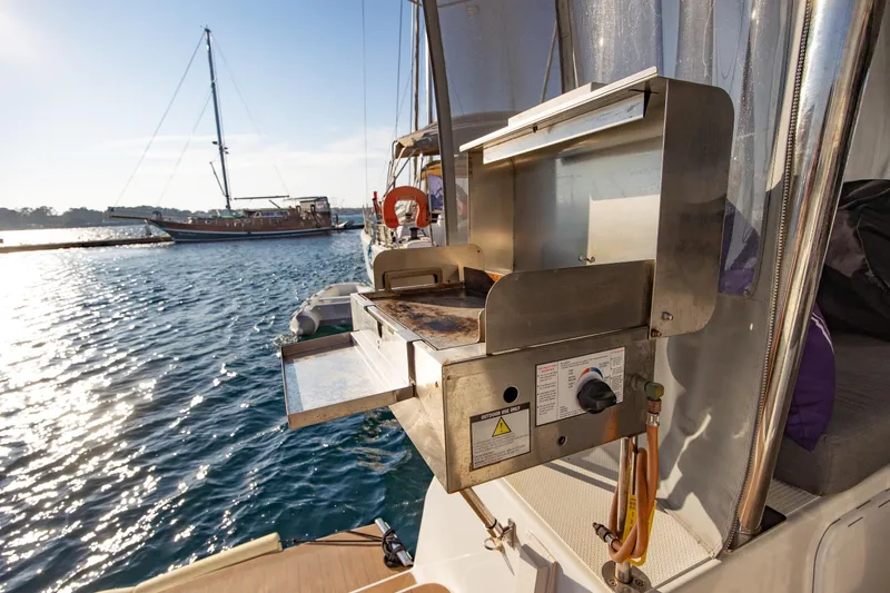 Slide: The Image of 2023 Fountaine Pajot Tanna 47 with inflatable dinghy and outboard motor. - 19