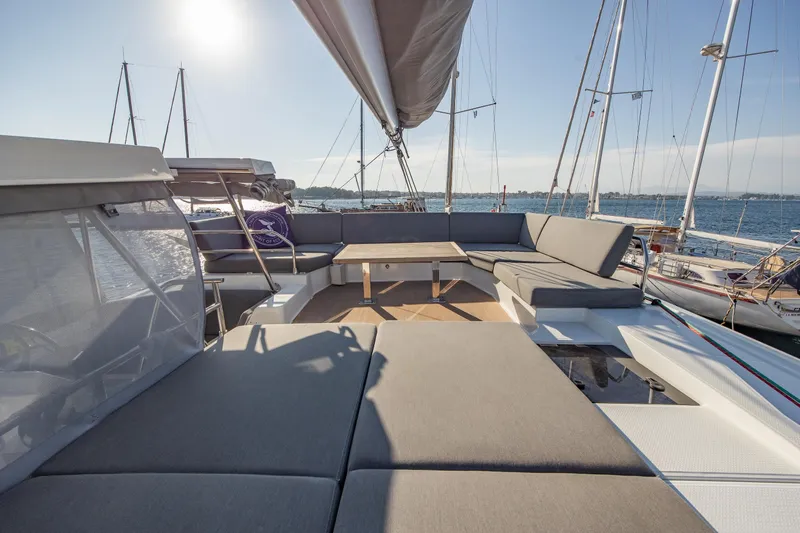 Slide: The Image of 2023 Fountaine Pajot Tanna 47 catamaran sailing on clear blue water. - 2