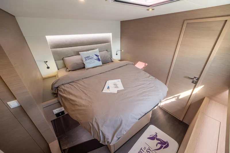 Slide: The Image of Modern bathroom in 2023 Fountaine Pajot Tanna 47 yacht with sleek design and plant decor. - 49
