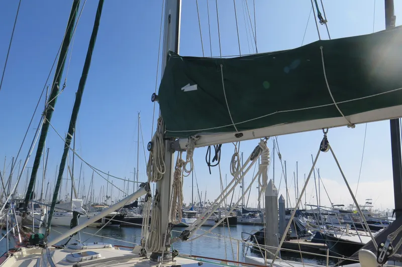 Slide: The Image of Deck view of 1990 Island Packet 35 sailboat, showcasing rigging and hatches. - 11