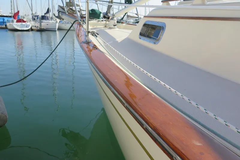 Slide: The Image of Deck view of a 1990 Island Packet 35 sailboat, featuring rigging and hatch. - 12