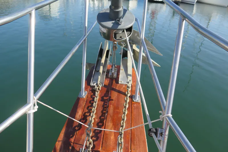 Slide: The Image of 1990 Island Packet 35 sailboat cockpit with green canopy and rigging details. - 16