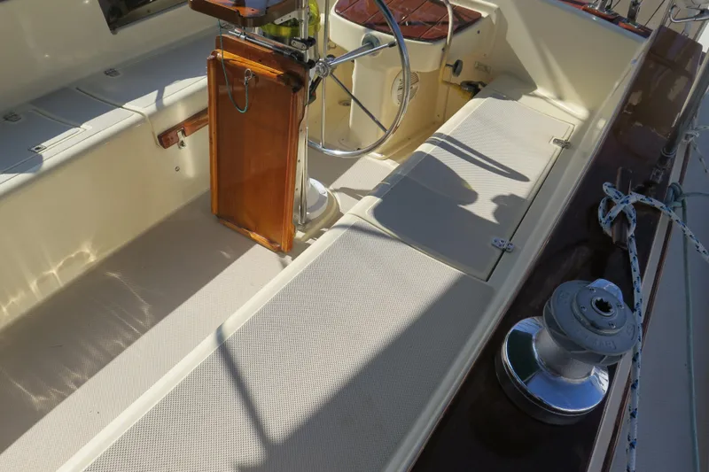 Slide: The Image of Engine compartment of a 1990 Island Packet 35 sailboat, showcasing mechanical components. - 20