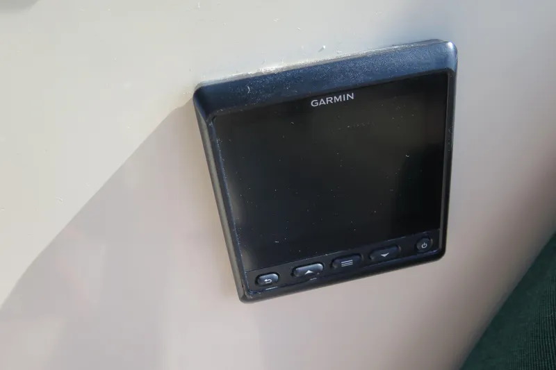 Slide: The Image of Cockpit of 1990 Island Packet 35 sailboat with steering wheel and wooden details. - 22