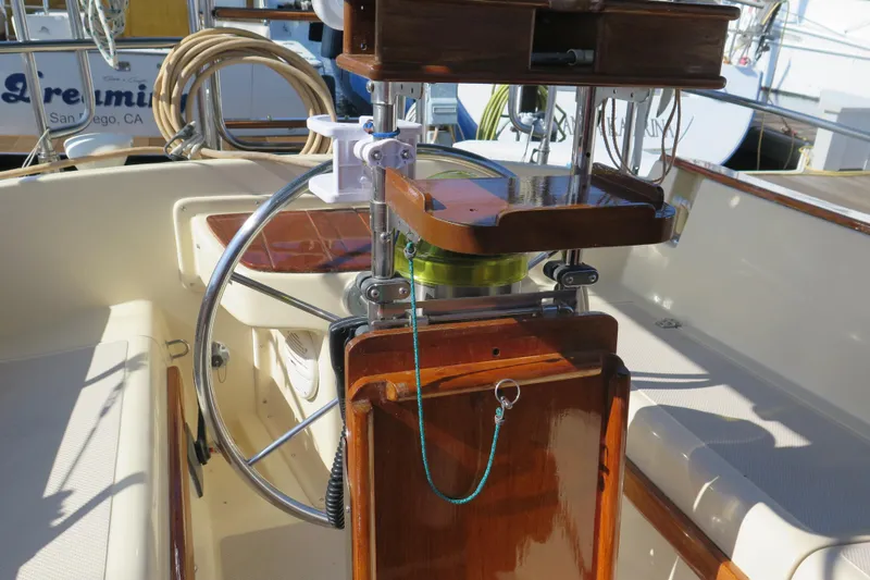 Slide: The Image of Control panel of a 1990 Island Packet 35 sailboat, featuring gauges and switches. - 25