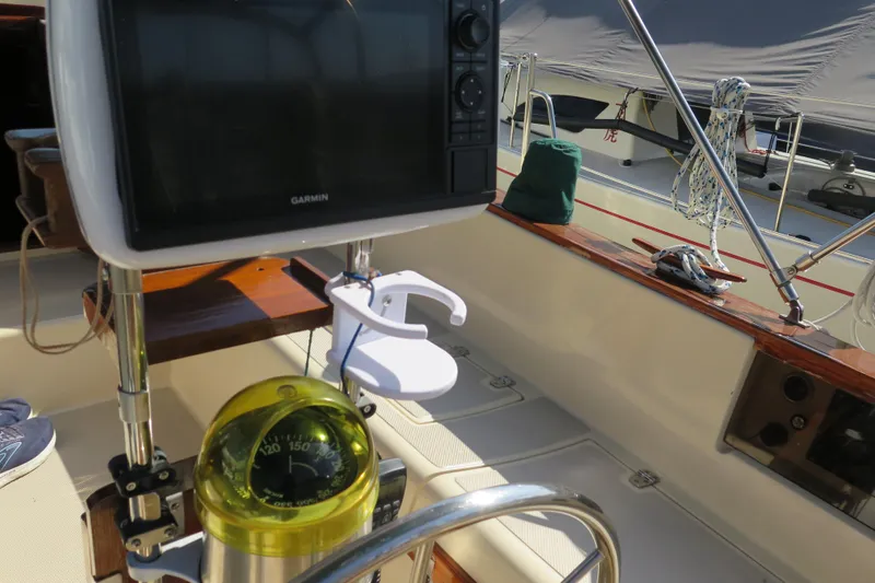 Slide: The Image of 1990 Island Packet 35 sailboat deck with winch, hatch, and ropes. - 26