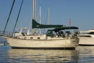 Slide: The Image of 1990 Island Packet 35 sailboat named Avalon docked in San Diego marina. - 3