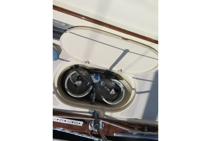 Slide: The Image of Interior of 1990 Island Packet 35 sailboat with navigation station and seating area. - 33