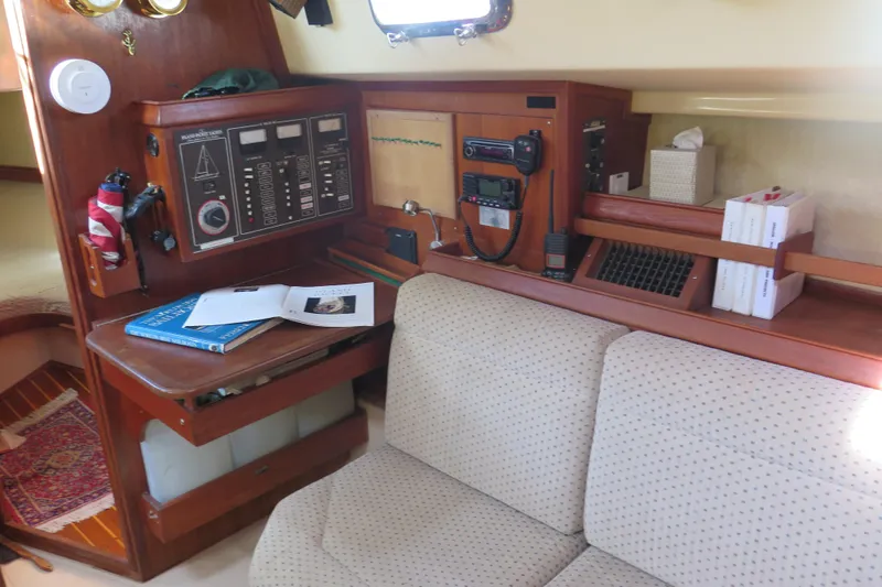 Slide: The Image of Control panel of a 1990 Island Packet 35 yacht, featuring various switches and gauges. - 36