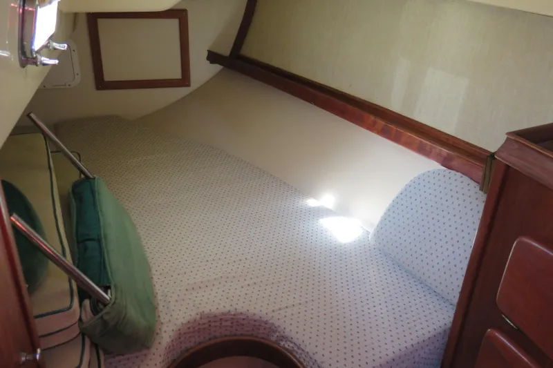 Slide: The Image of Brass clock and barometer on 1990 Island Packet 35 yacht's wooden interior. - 37