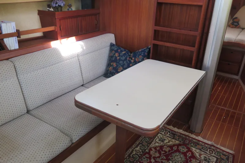 Slide: The Image of Shower area in 1990 Island Packet 35 sailboat with chrome fixtures and curtain. - 42