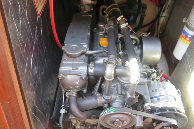 Slide: The Image of Interior of 1990 Island Packet 35 sailboat with cozy seating and wooden cabinetry. - 43