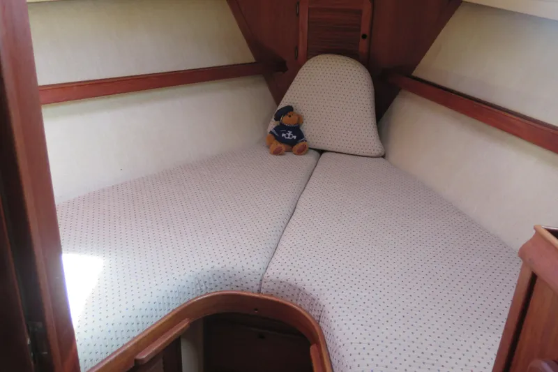 Slide: The Image of Island Packet 35 emblem on 1990 sailboat, featuring a star design. - 52