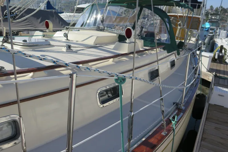 Slide: The Image of Sailboat Island Packet 35, 1990 model, docked with clear blue sky background. - 8