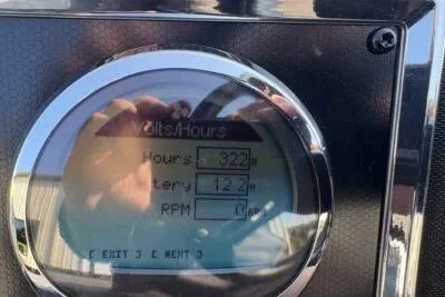 Slide: The Image of Close-up of Ranger Z520R 2025 dashboard display showing hours, battery, and RPM. - 10