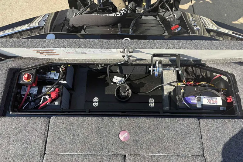 Slide: The Image of 2025 Ranger Z520R boat battery compartment with wiring and components. - 6