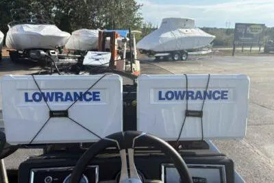 Slide: The Image of 2025 Ranger Z520R boat with dual Lowrance displays in a marina setting. - 8