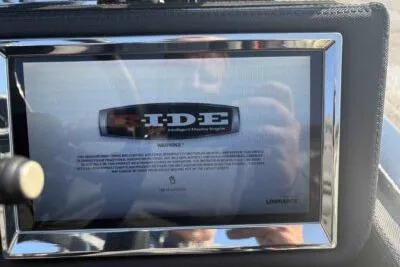 Slide: The Image of 2025 Ranger Z520R dashboard display with IDE logo and warning message. - 9