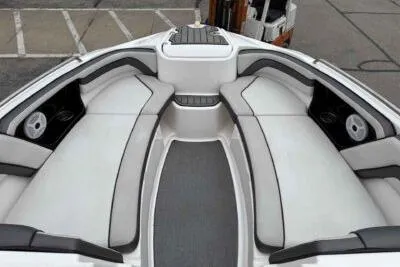 Slide: The Image of 2018 Yamaha Boats AR240 interior with spacious seating and sleek design. - 11
