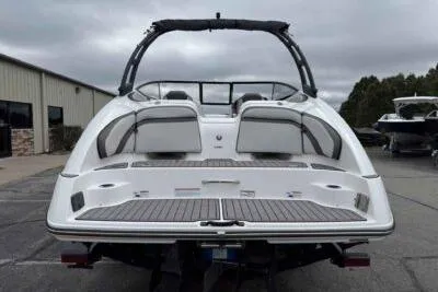 Slide: The Image of 2018 Yamaha Boats AR240, rear view, showcasing sleek design and spacious seating. - 5