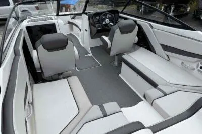 Slide: The Image of 2018 Yamaha Boats AR240 interior with sleek seating and modern dashboard design. - 6