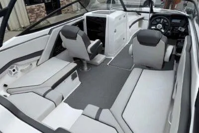 Slide: The Image of 2018 Yamaha Boats AR240 interior with modern seating and sleek design. - 7