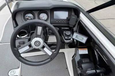 Slide: The Image of 2018 Yamaha Boats AR240 dashboard with steering wheel and control panel. - 9