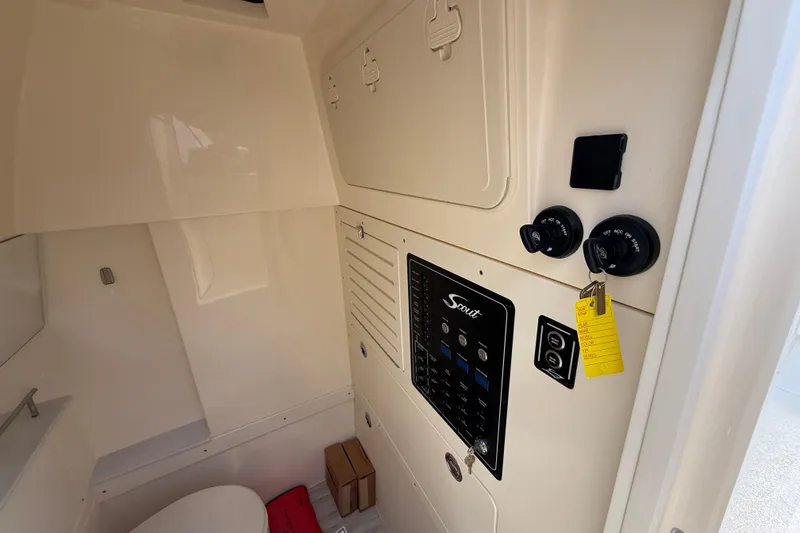 Slide: The Image of 2026 Scout 288 LXF boat interior with control panel and storage compartments. - 27