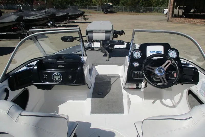 Slide: The Image of 2026 Nitro Z19 Sport boat interior with steering wheel and dashboard controls. - 4