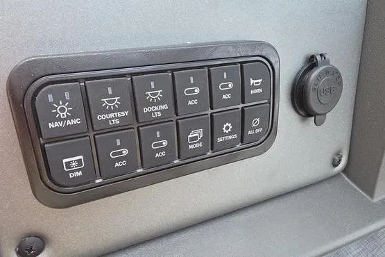 Slide: The Image of Control panel of 2026 Sun Tracker Party Barge 20 DLX with various switches and USB port. - 13