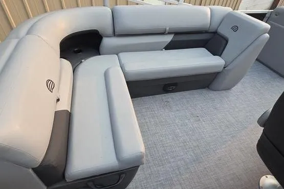 Slide: The Image of 2026 Sun Tracker Party Barge 20 DLX with spacious gray seating and modern design. - 16