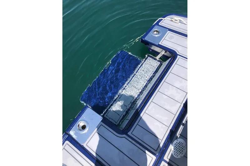 Slide: The Image of 2022 Chaparral 267 SSX swim platform with water view. - 3