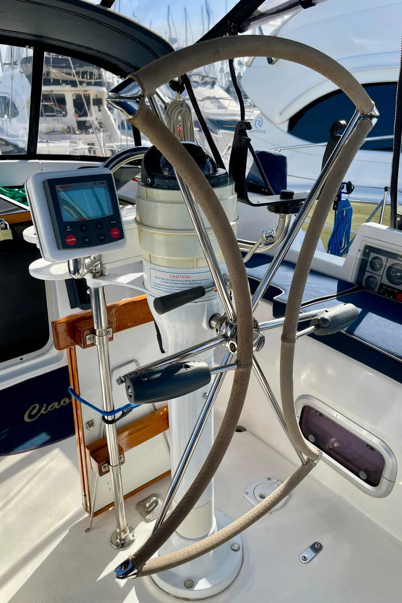 Slide: The Image of Steering wheel and navigation equipment on a 1998 Hunter Passage 42 sailboat. - 24