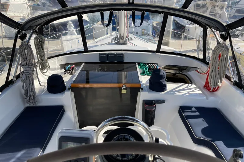 Slide: The Image of Cockpit view of 1998 Hunter Passage 42 sailboat with navigation equipment and seating. - 26