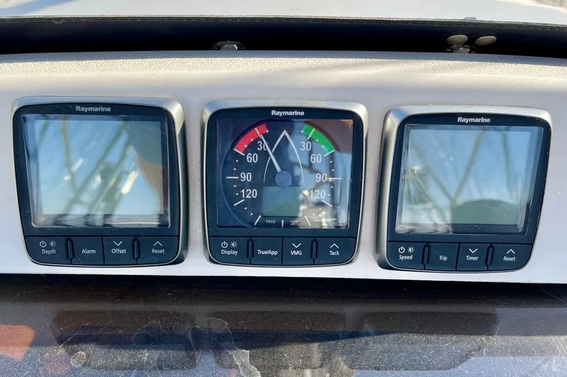 Slide: The Image of Raymarine instrument panel on 1998 Hunter Passage 42 sailboat, featuring navigation displays. - 27