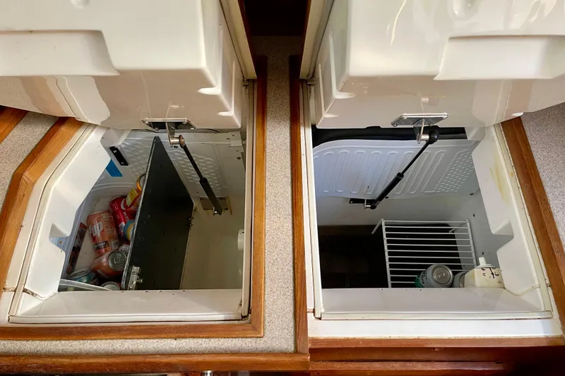 Slide: The Image of Interior view of a 1998 Hunter Passage 42 yacht's dual storage compartments. - 42