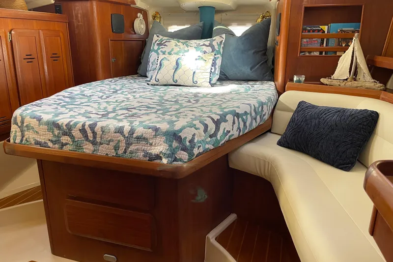 Slide: The Image of Cozy cabin interior of 1998 Hunter Passage 42 sailboat with bed and seating area. - 47
