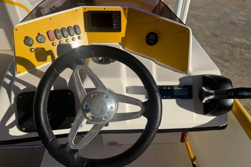 Slide: The Image of Steering console of 2022 Aloha Pontoon Tropical 260 with controls and dashboard. - 8