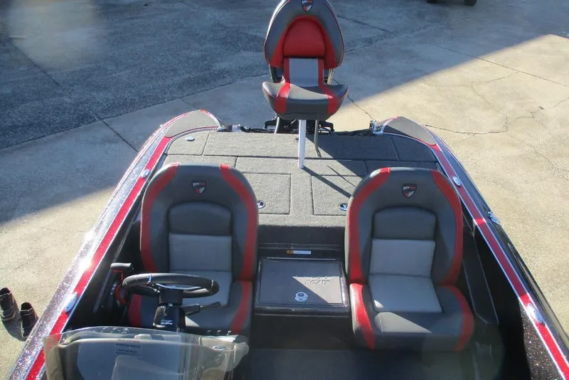 Slide: The Image of 2026 Triton 179 TrX boat interior with steering wheel and control panel. - 6