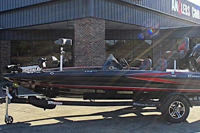 Slide: The Image of 2026 Triton 179 TrX boat deck with trolling motor and foot pedal controls. - 8