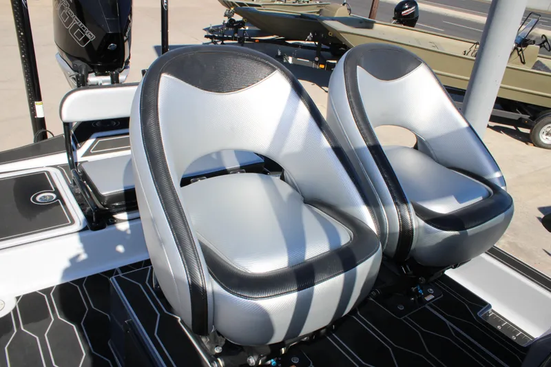Slide: The Image of Two sleek seats on a 2025 Mamba 24 Cat Elite boat. - 11