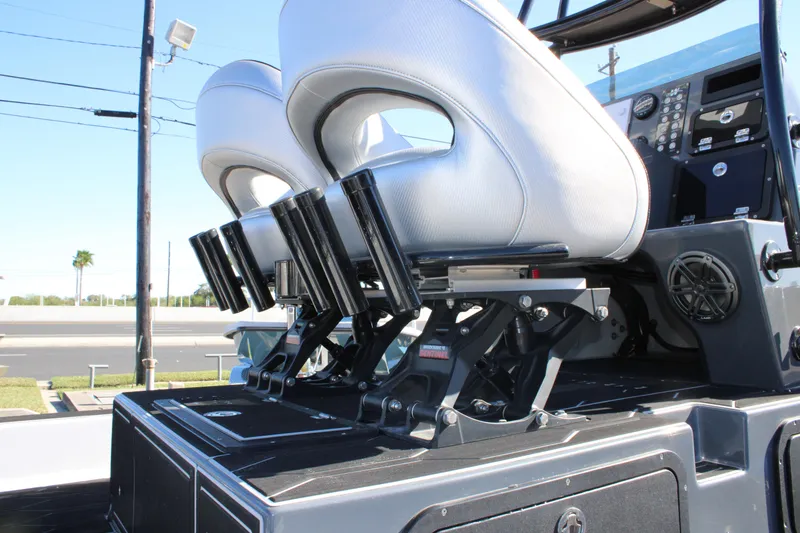 Slide: The Image of 2025 Mamba 24 Cat Elite boat interior with modern seating and control panel. - 21