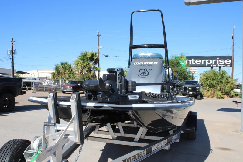 Slide: The Image of 2025 Mamba 24 Cat Elite boat on trailer, parked outdoors. - 3