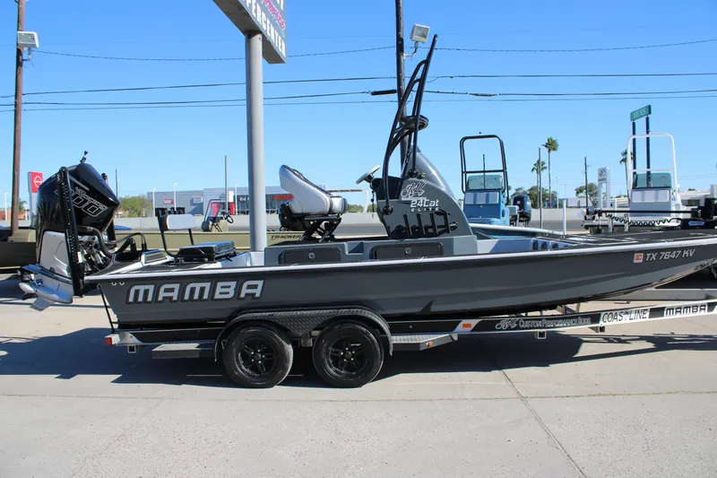 Slide: The Image of 2025 Mamba 24 Cat Elite boat on trailer, displayed outdoors. - 4
