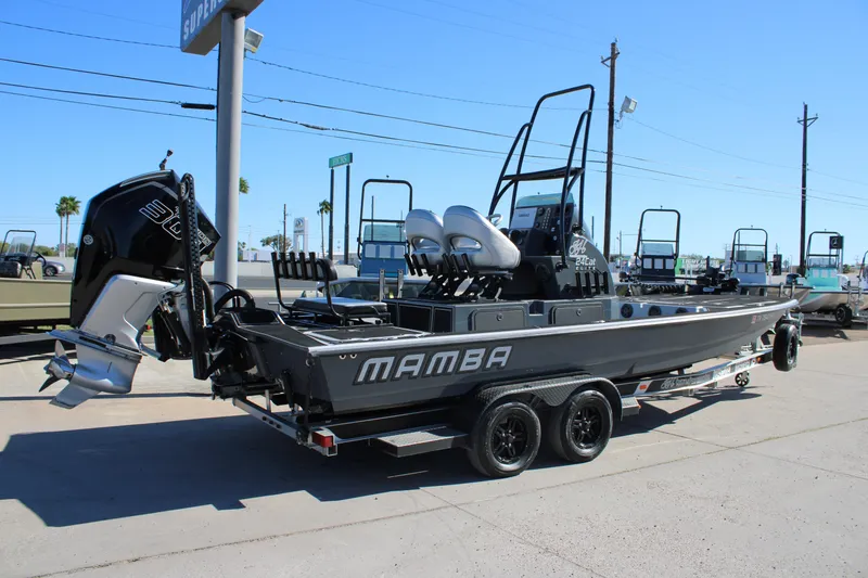 Slide: The Image of 2025 Mamba 24 Cat Elite boat on trailer, featuring powerful outboard motor. - 5