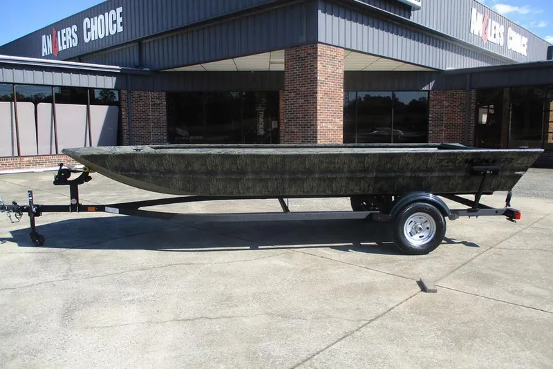 The Image of 2026 Tracker Grizzly 1860 Utility boat on trailer outside Anglers Choice store. - 1